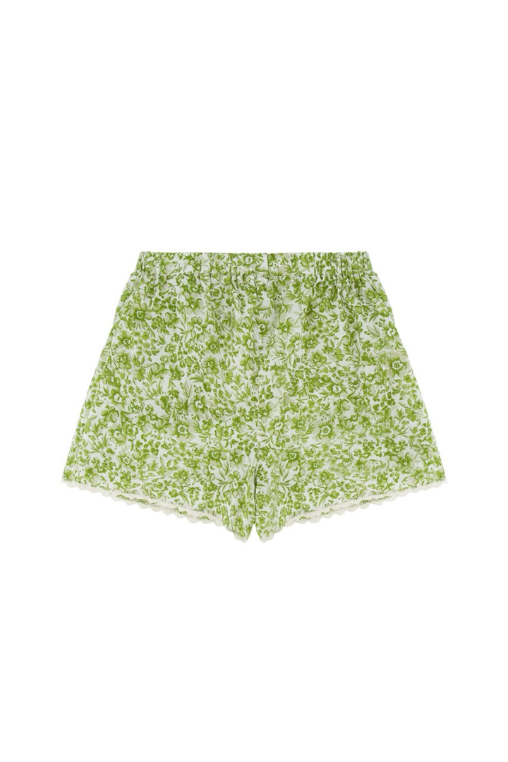 Green floral shorts on a white background